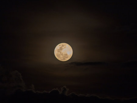 Full moon in the night sky with clouds, good night background.の写真素材