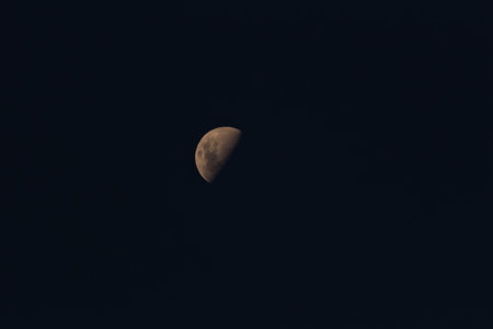 The moon in the night sky. Close-up. Toned.の写真素材