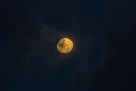 Moon at night with clouds in the sky, closeup of photoの写真素材