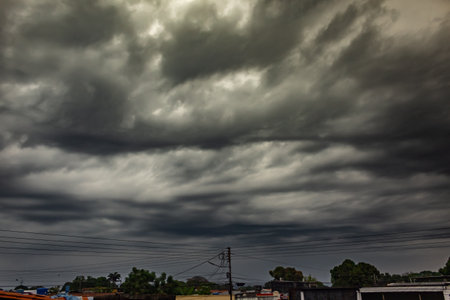 Dramatic sky with stormy clouds in countryside of Thailand.の写真素材