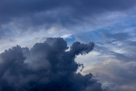 Clouds before a thunder-storm at sunset as an abstract background.の写真素材