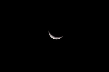 A close up of the crescent moon in the night sky.の写真素材