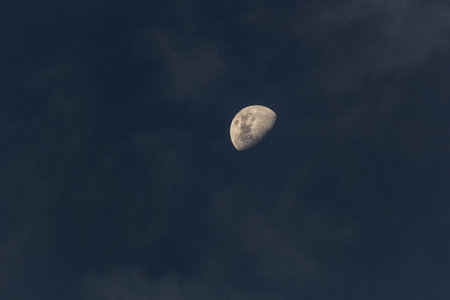 The moon in the dark sky with clouds. Sepia tone.の写真素材