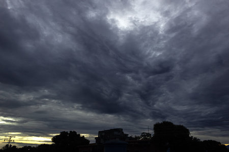 Dramatic sky with storm clouds at sunsetの写真素材