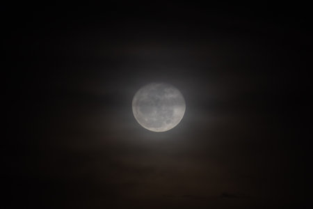 Full moon in the night sky with clouds, can be used as backgroundの写真素材