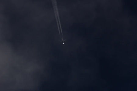 Airplane in the dark sky. Airplane in the sky.の写真素材