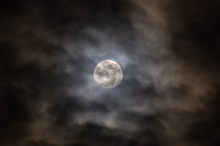 Full moon in the dark night sky with clouds. Halloween background.の写真素材