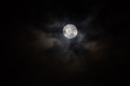 Full moon in the night sky with clouds, 3D illustration.の写真素材