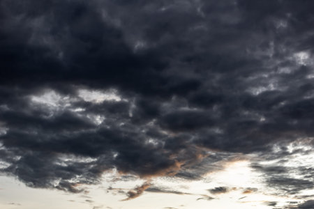 Cloudscape, Colored Clouds at Sunset near the Ocean with a Dark Sky
