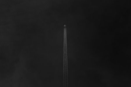 3d rendering of a black smoke trail on a black background.の写真素材
