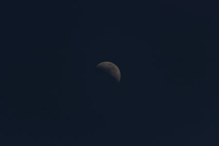 Moon in the dark sky, closeup of photo with selective focusの写真素材