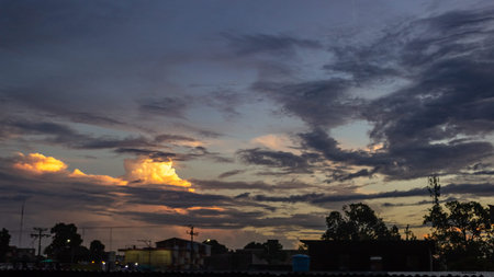 Sunset in the city. Beautiful sky with clouds at sunset.