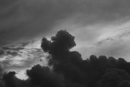 Black and white clouds in the sky, monochrome background.