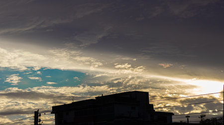 Silhouette of a building with sunset sky in the background.の写真素材