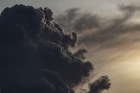 Dramatic dark clouds before a thunderstorm at sunset.の写真素材