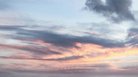 Beautiful sunset sky with clouds. Panoramic view of sunset sky.