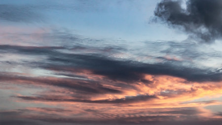 Cloudscape, Colored Clouds at Sunset near the Ocean as a Backgroundの写真素材