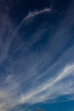 blue sky background with white clouds and contrail, beautiful photo digital picture