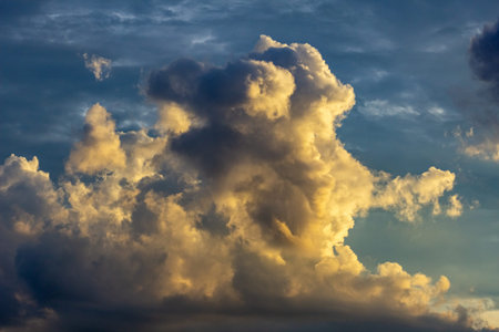 Cloudscape, Colored Clouds at Sunset near the Ocean on a Blue Sky
