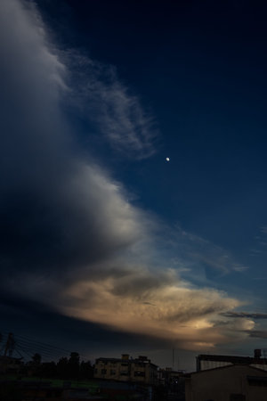 Cloudscape, Colored Clouds at Sunset near the Ocean with a Moon