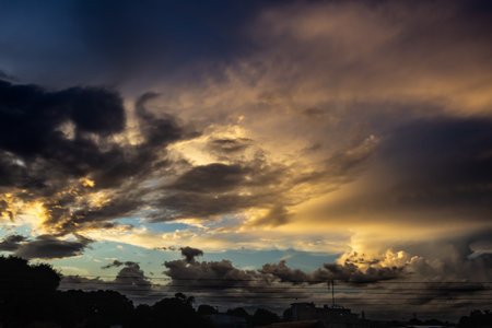 Cloudscape, Colored Clouds at Sunset near the Ocean in a Tropical Climateの写真素材