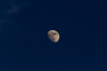 The moon in the blue sky. Selective focus. Toned.の写真素材