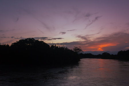 Sunset over the Mekong River in the city of Luang Prabang in Laos.の写真素材