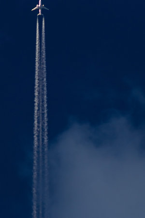 Airplane in the sky with clouds.