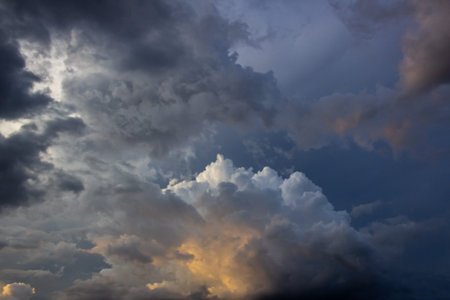 Clouds before a thunderstorm at sunset as a background.