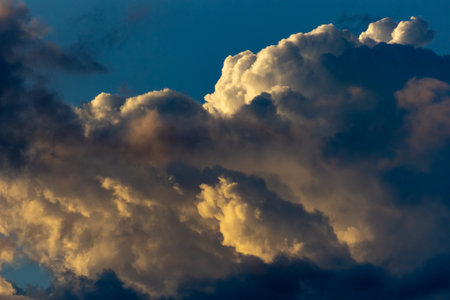 Cloudscape, Colored Clouds at Sunset near the Ocean in a Blue Skyの写真素材