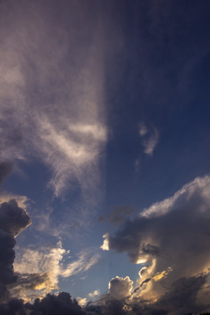 Cloudscape, Colored Clouds at Sunset near the Ocean on a Cloudy Dayの写真素材