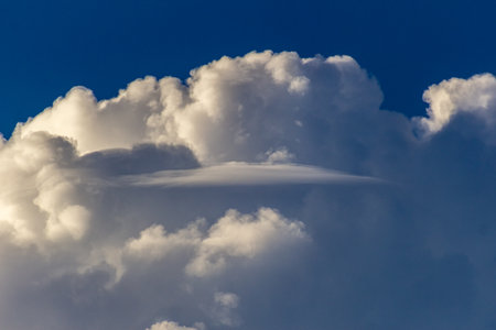 Cloudscape has been developing in gorgeous form. The picture presents huge cumulus clouds.の写真素材