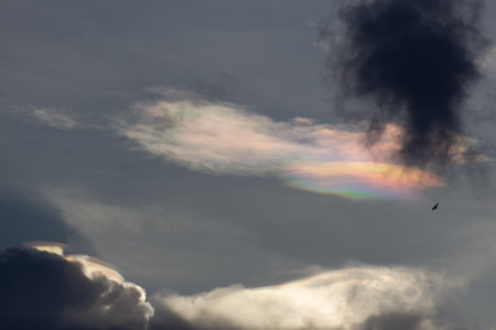 The clouds are multicolored with a rainbow.の写真素材