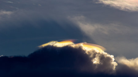 Clouds with rainbow in the sky at sunset. Abstract background.の写真素材