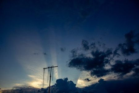 silhouette of sky with cloud and sun ray on the eveningの写真素材