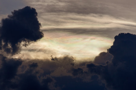 Cloudscape, Colored Clouds at Sunset near the Ocean with a Rainbowの写真素材