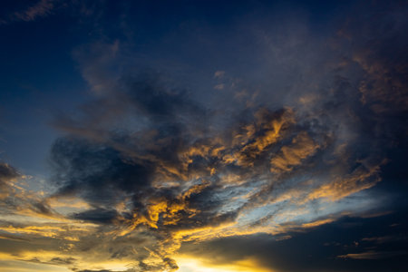 Dramatic sunset sky with clouds. Nature background. Toned.の写真素材
