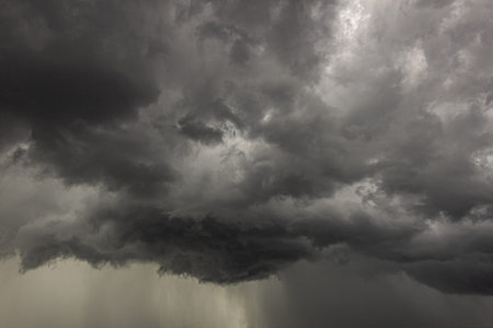 Dramatic dark stormy sky with rain clouds. Nature background