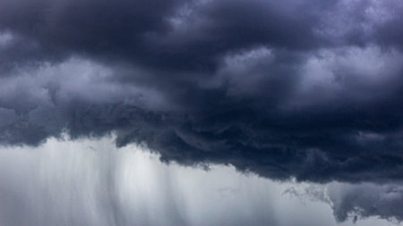 Dramatic dark stormy sky with rain clouds, natural backgroundの写真素材