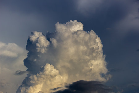 Clouds in the blue sky before a thunderstorm at sunset.の写真素材
