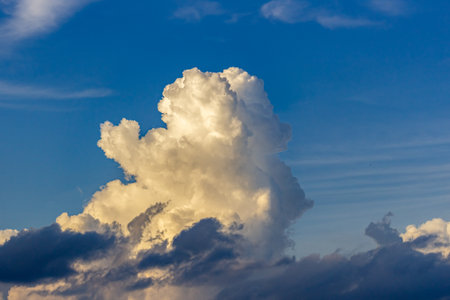 Cloudscape has been developing in gorgeous form. The background is blue sky and white clouds.の写真素材