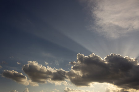 The vast blue sky and clouds.