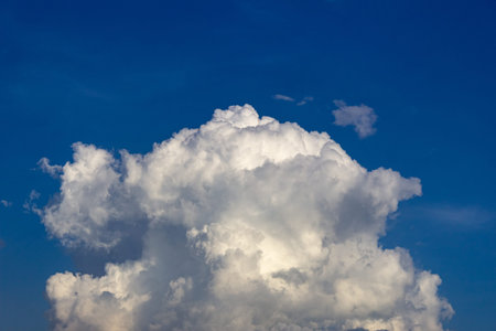 Blue sky background with white clouds. Cumulus white clouds in the blue sky.