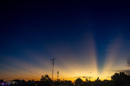 sunset sky with clouds and rays of the sun in the evening