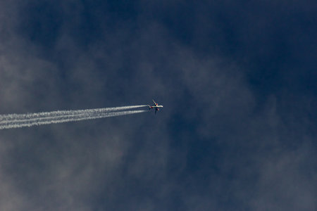 Airplane in the blue sky with clouds. Airplane in the sky.の写真素材