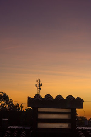 silhouette of building with sunset background, vintage tone.の写真素材