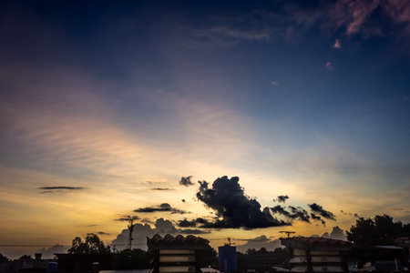 Sunset in the city with blue sky and white clouds background.の写真素材