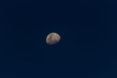Moon in the dark blue sky, natural background.