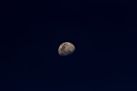 Moon in the night sky, closeup of photo with selective focus