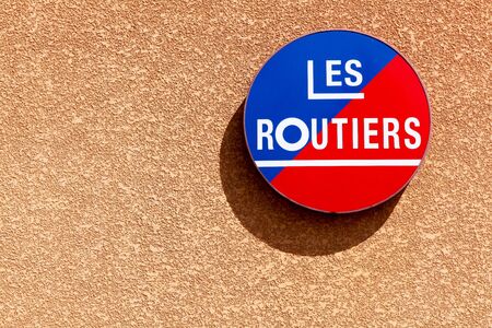 Belleville, France - July 16, 2015: Les Routiers logo. Les Routiers is a company that provides travel guide books for eating out and hotels in France. It began in France in 1935 and in 1970 in UKのeditorial素材